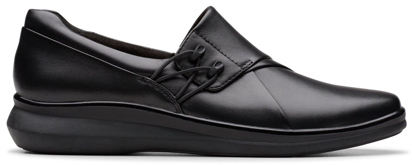 Black slip-on dress shoe with decorative ties.