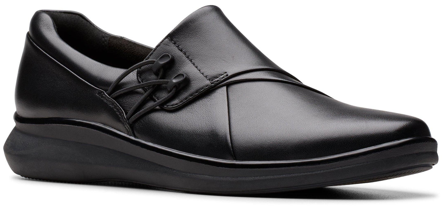 A black slip-on shoe with laces.