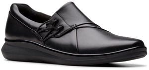 A black slip-on shoe with laces.
