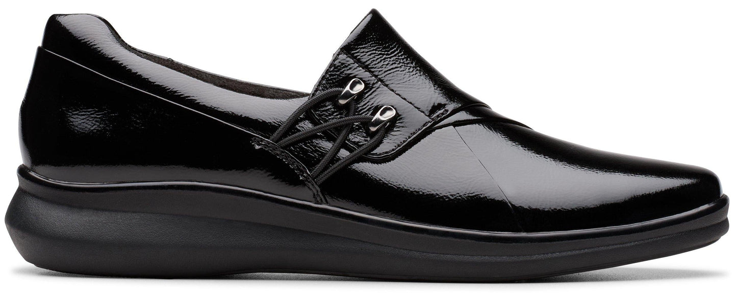 A shiny black slip-on shoe with black laces.