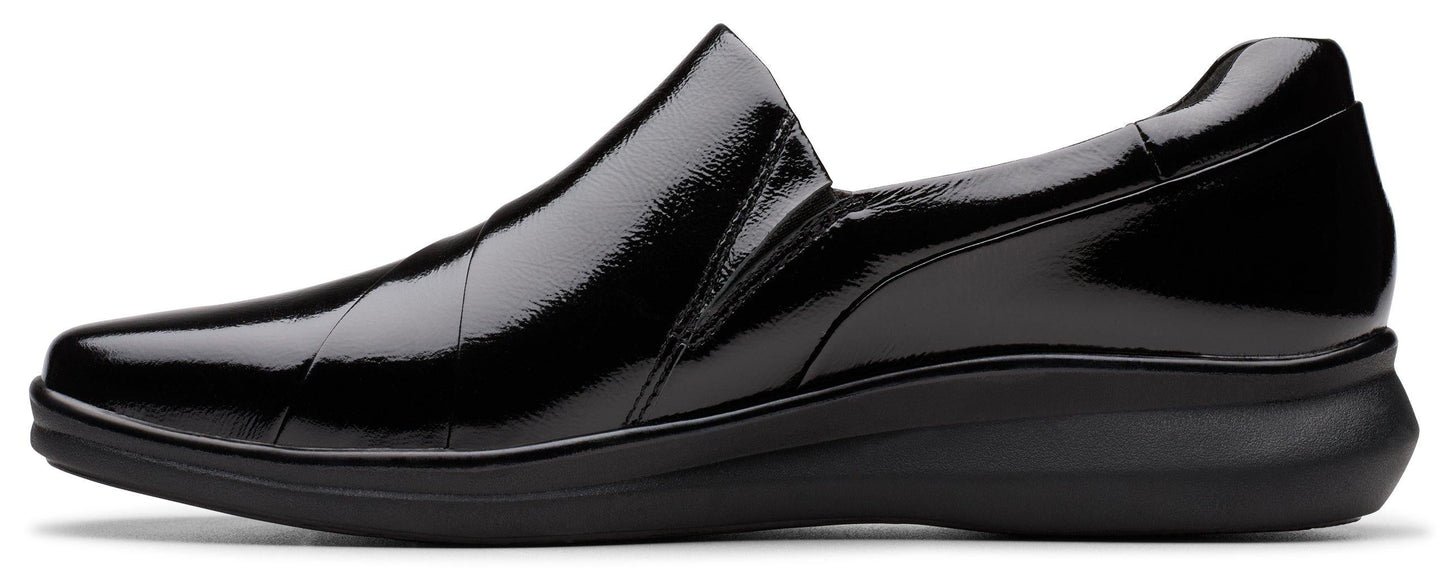 A shiny black slip-on dress shoe.