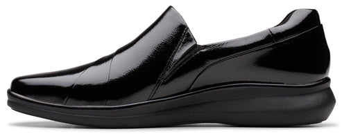 A shiny black slip-on dress shoe.