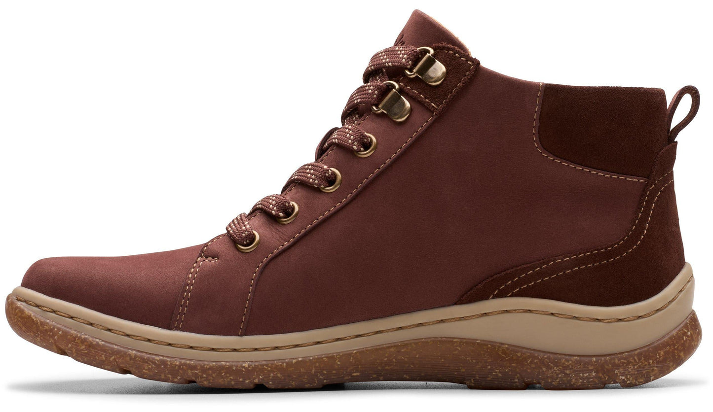 A red-brown high-top sneaker with matching laces and a rugged sole.
