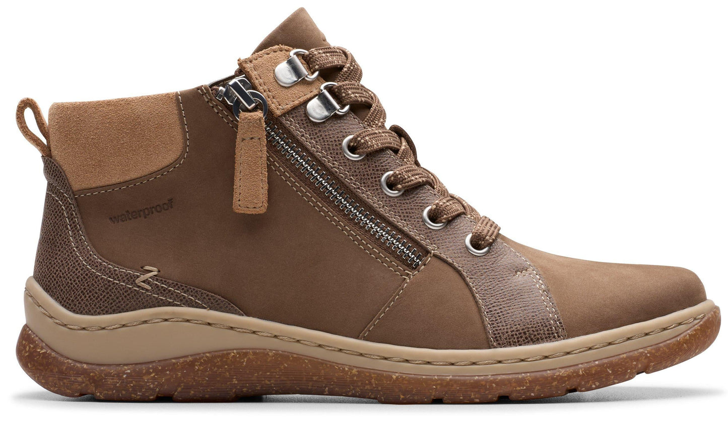 Brown ankle boot with laces, side zipper, lug sole, and suede back.