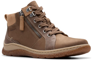 A brown ankle boot with a side zipper, laces, metal eyelets and a brown sole.