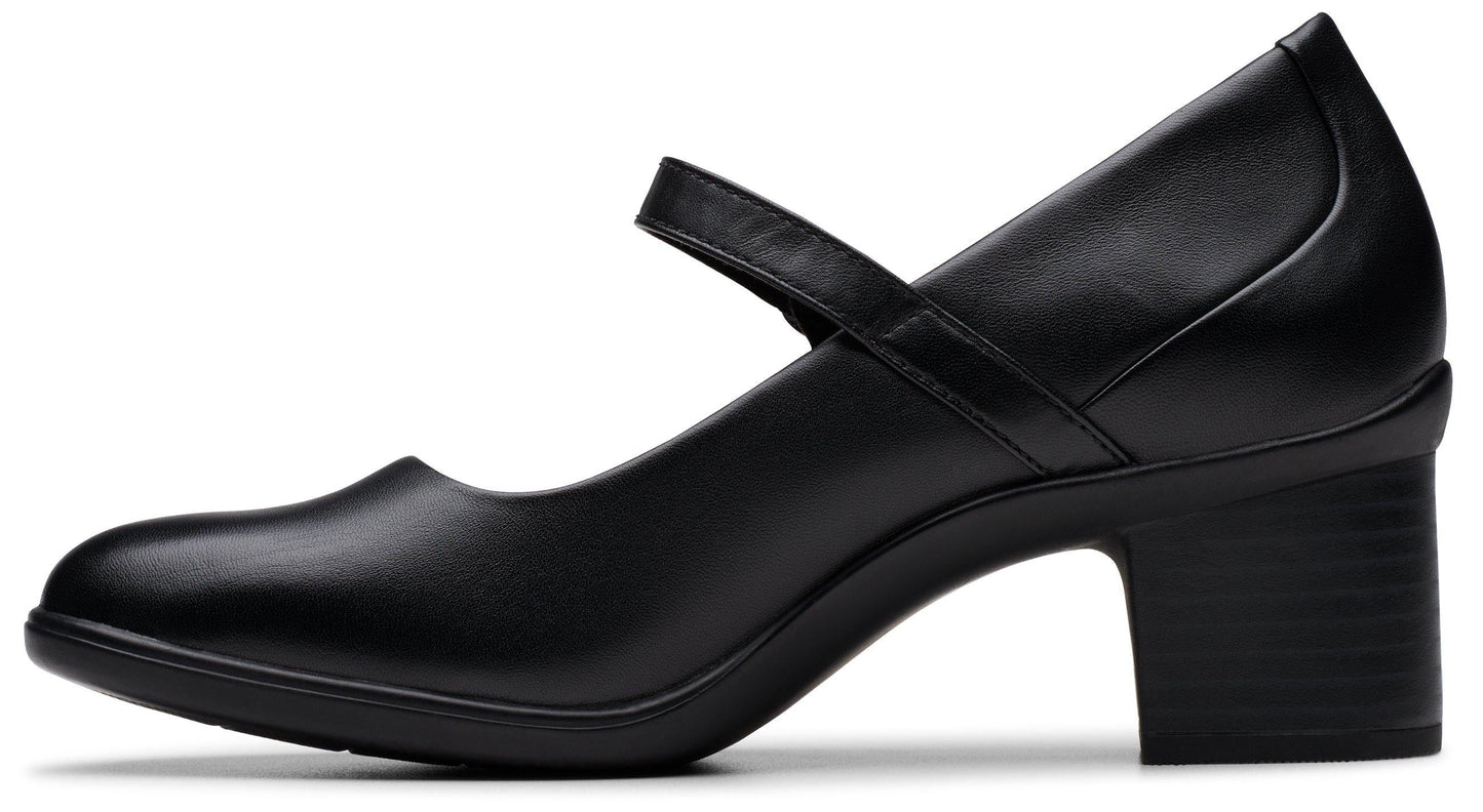 Black leather Mary Jane shoe with block heel.