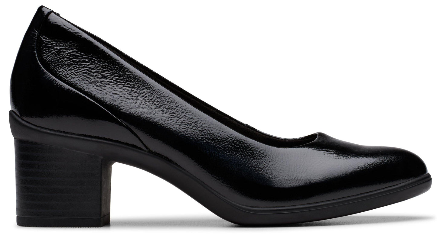 Black patent leather block heel pump.