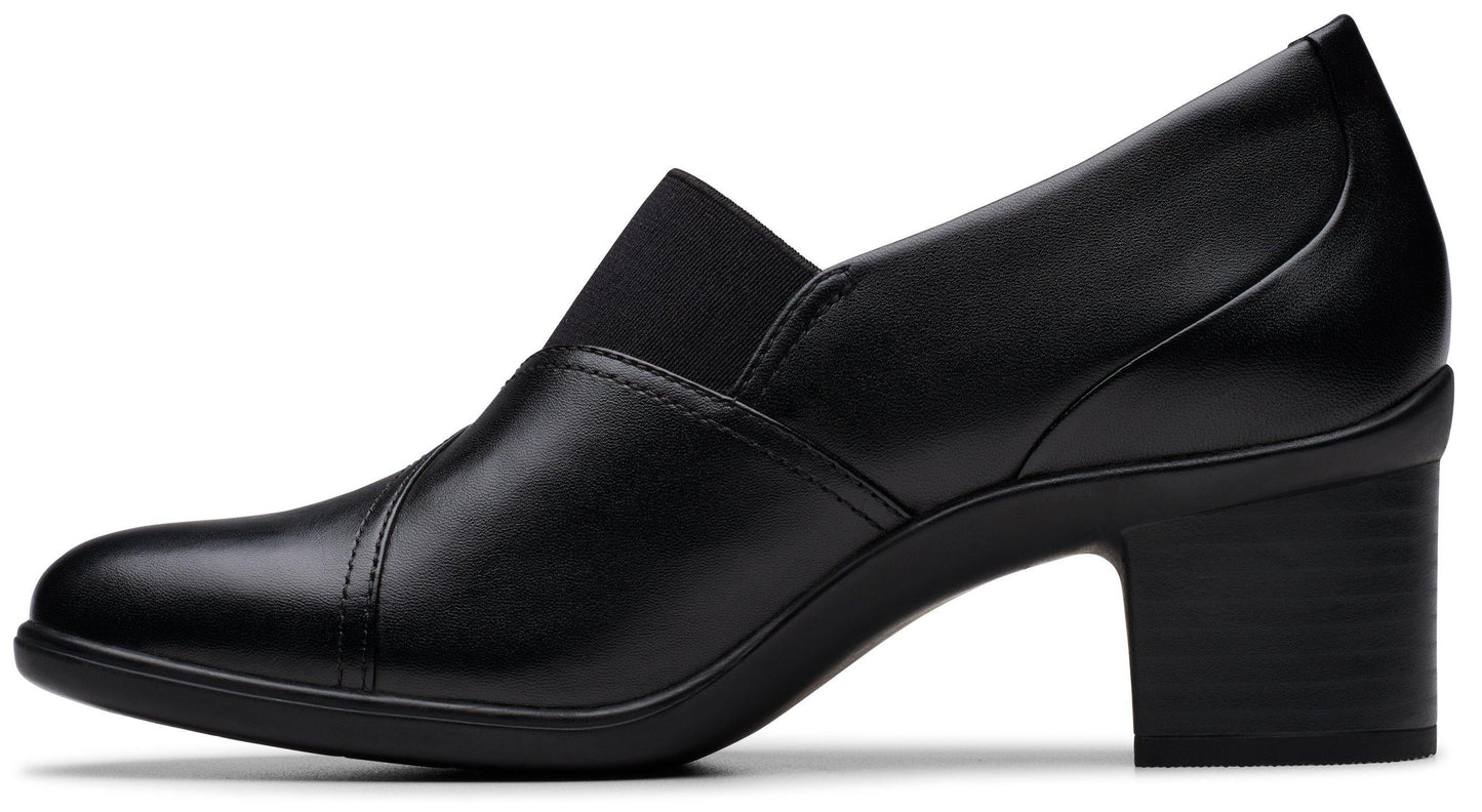 Black heeled leather pump with an elastic gore detail at the vamp.