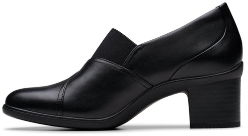 Black heeled leather pump with an elastic gore detail at the vamp.