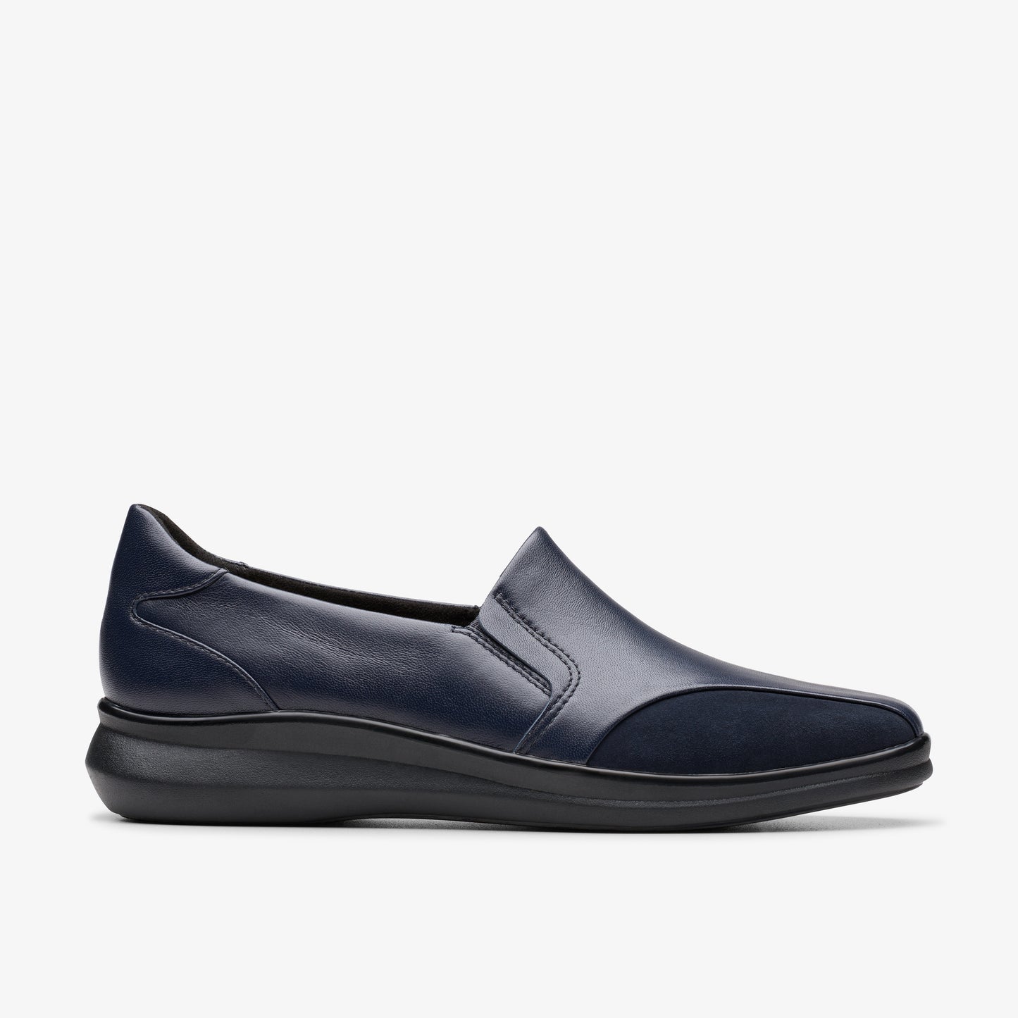 Slip-on navy leather shoe with slight wedge heel.