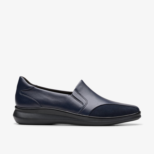 Slip-on navy leather shoe with slight wedge heel.