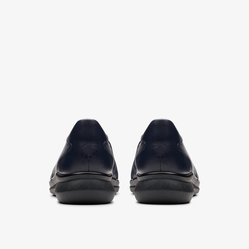 Pair of navy blue slip-on shoes, back view.