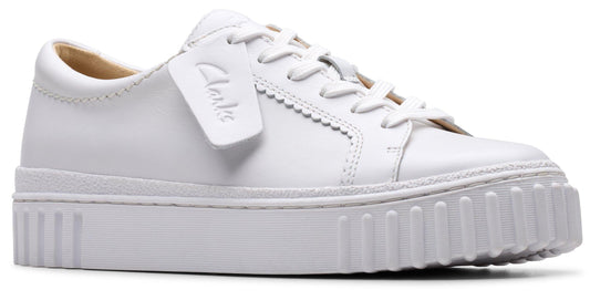 White leather platform sneaker with scallop trim.