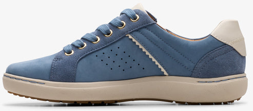A blue sneaker with a tan sole and white heel.