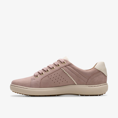 Low-top pink sneaker with beige rubber sole and white heel.