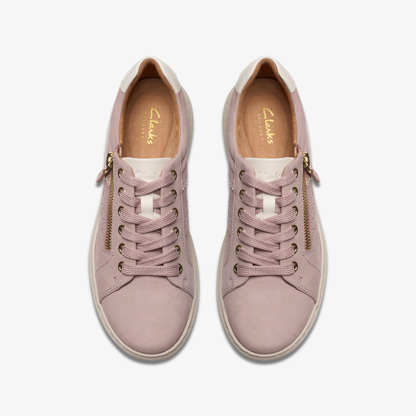 Pair of mauve-colored leather sneakers with laces and side zippers, top view.