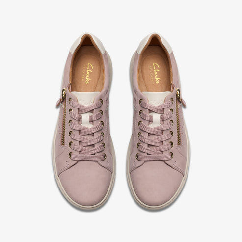 Pair of mauve-colored leather sneakers with laces and side zippers, top view.