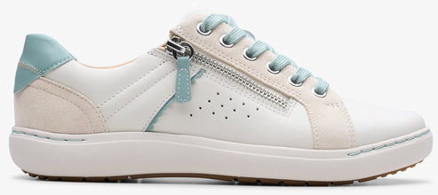 A white sneaker with a side zipper and mint green accents.