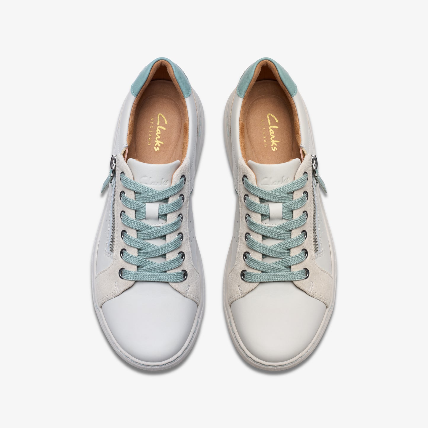 Overhead view of white lace-up shoes with zipper and light blue laces and interior.