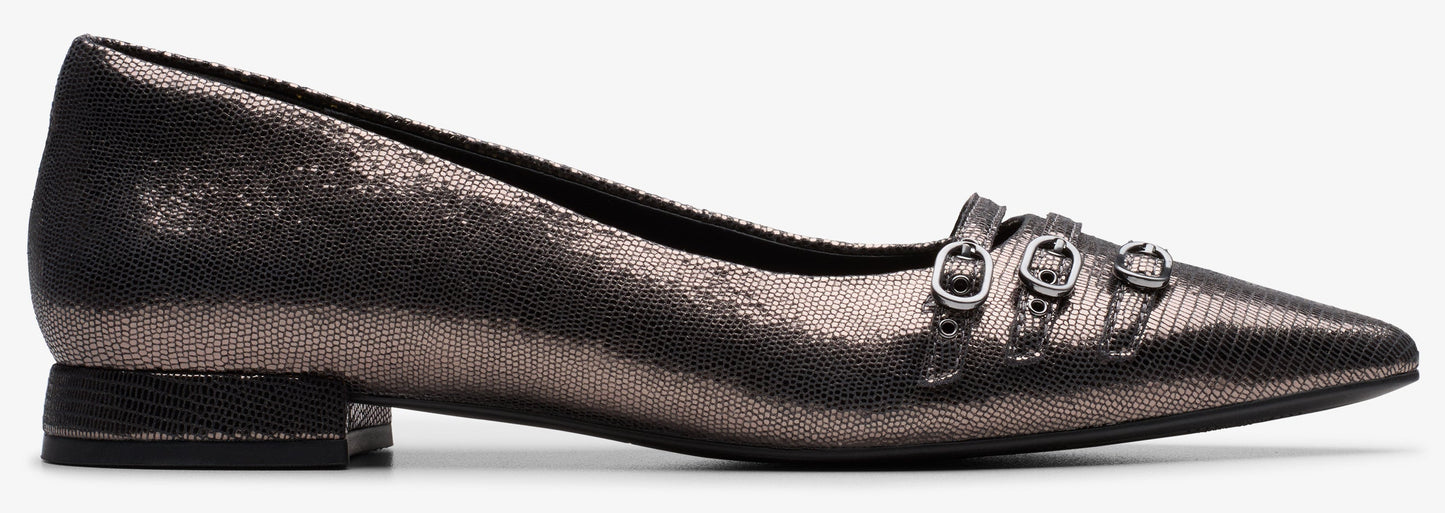 Pointed-toe flat shoe in a metallic fabric with three straps and buckles across the vamp.