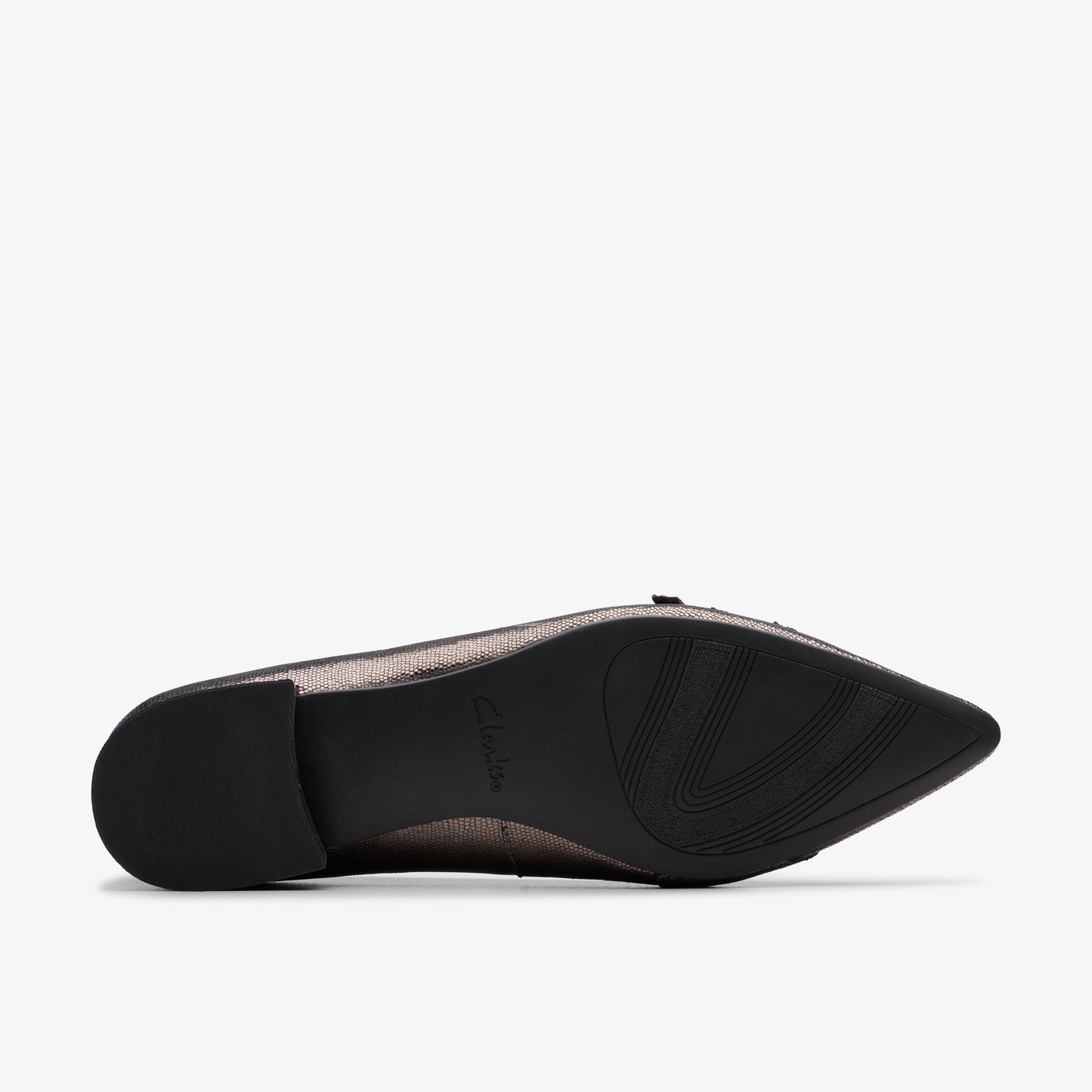 Close-up of a shoe showing a black sole with curvy treads.