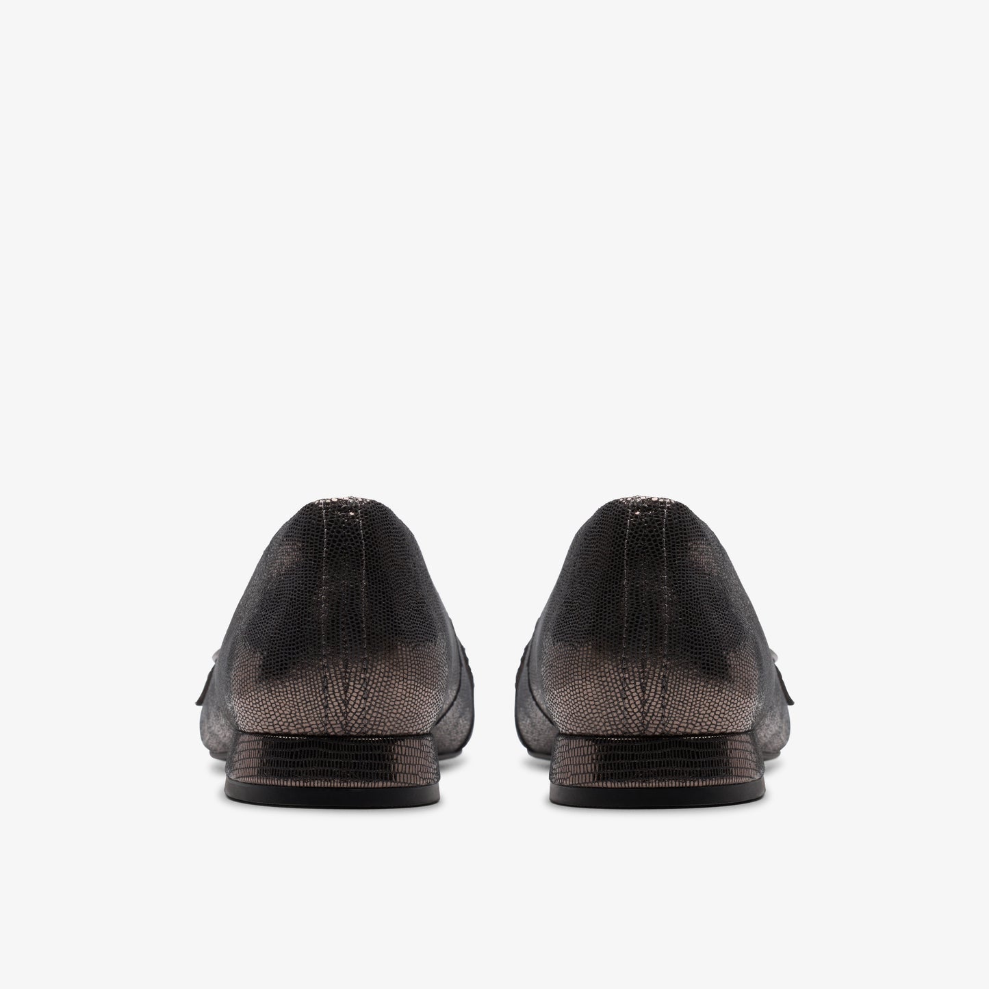 A pair of flats, viewed from the back.