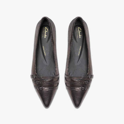 Pair of shiny, metallic pointed-toe flats with decorative strap and visible insole labeled "Clarks Signature".