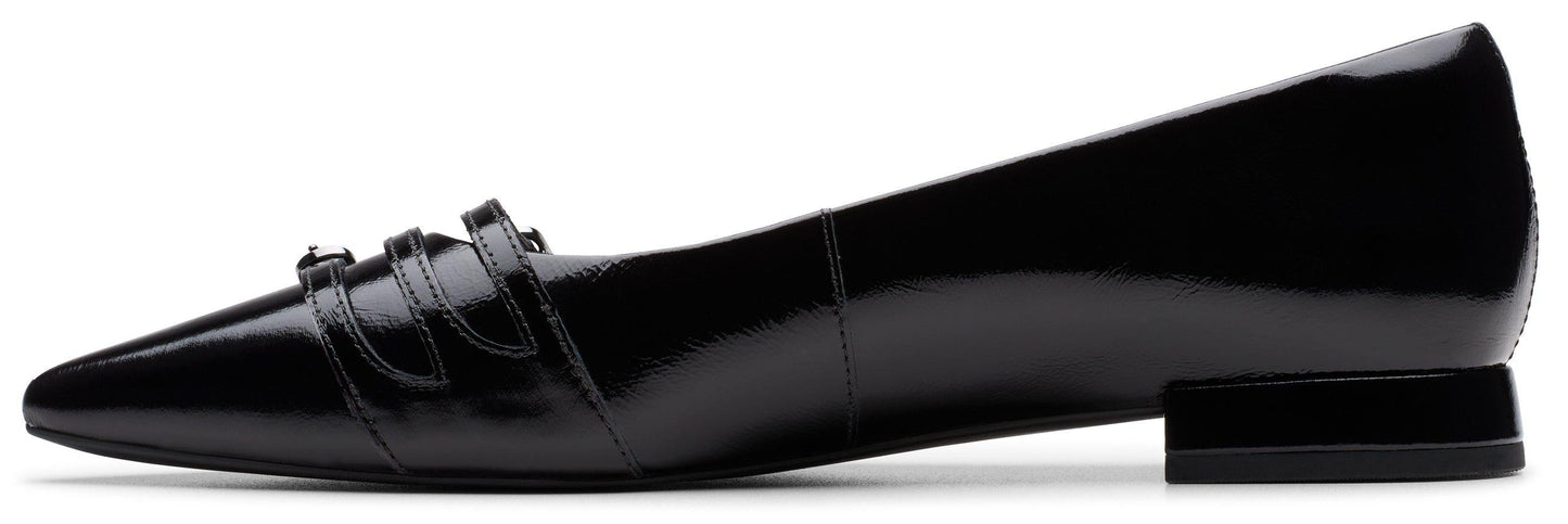 A black patent leather loafer with a pointed toe and triple monk strap detail.
