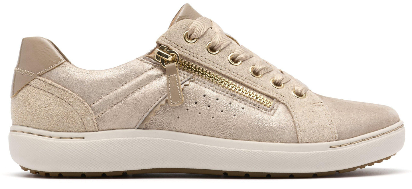 A beige sneaker with a gold zipper.