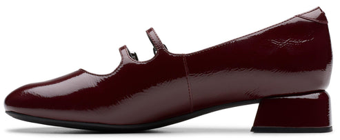 Burgundy patent leather Mary Jane heel.