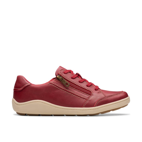 Red leather casual sneaker with tan sole, laces and side zipper.