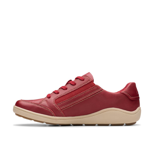 Red leather sneaker with a tan sole.