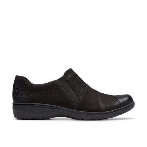 A black leather slip-on shoe with an elastic cross strap.