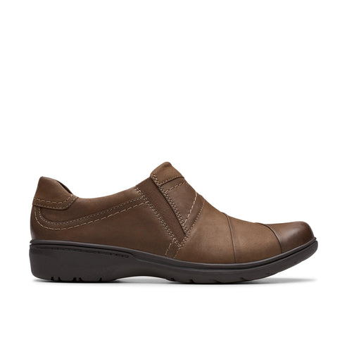 Brown leather slip-on shoe with elastic accents and low heel.