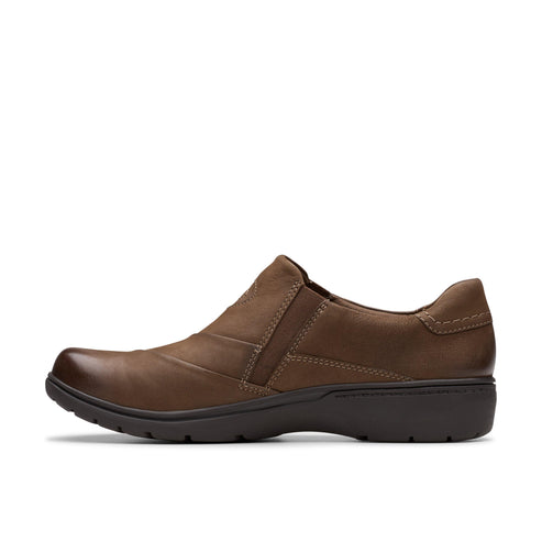A brown leather slip-on shoe with a low heel.
