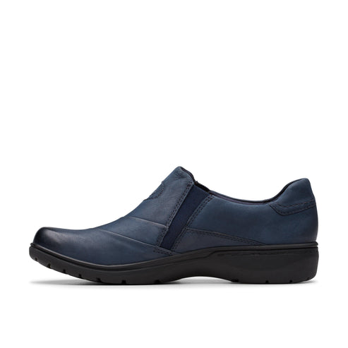 Navy slip-on shoe with a rounded toe and a low, black sole.