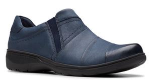 Slip-on style shoe with navy leather upper and black sole.