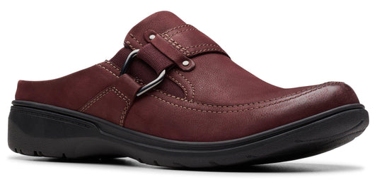 A burgundy leather slip-on shoe with a black sole and a decorative silver ring.