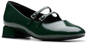 Green shiny shoe with two buckled straps.