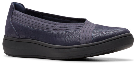 A navy blue slip-on shoe with a ridged texture and a dark sole.