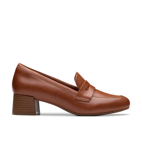 Brown leather loafer with a block heel.