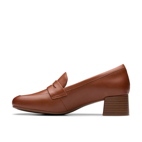 A brown leather loafer with a medium block heel.