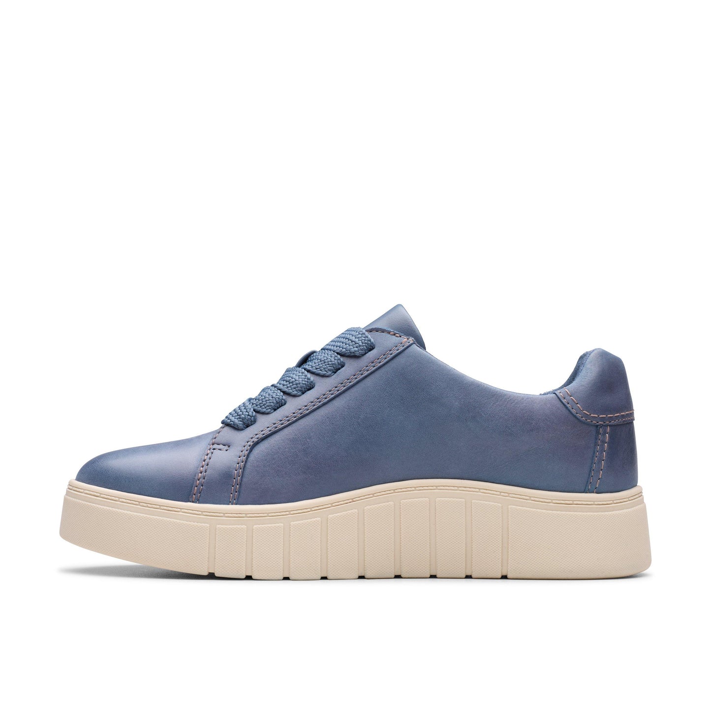 Blue leather sneaker with a ridged, off-white sole.