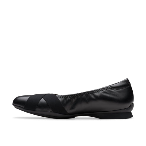 A black leather ballet flat with an elastic band.