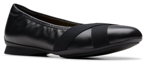 Black ballet flat with crossed elastic straps.