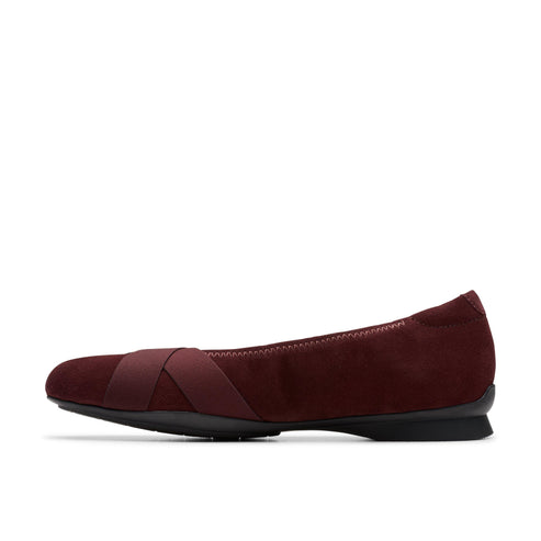 Maroon ballet flat with criss-cross straps.
