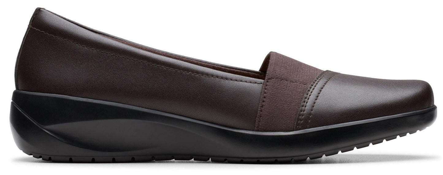 Brown slip-on shoe with elastic strap.