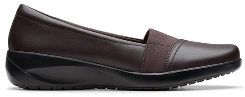 Brown slip-on shoe with elastic strap.