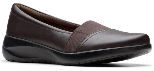 A brown slip-on wedge shoe.