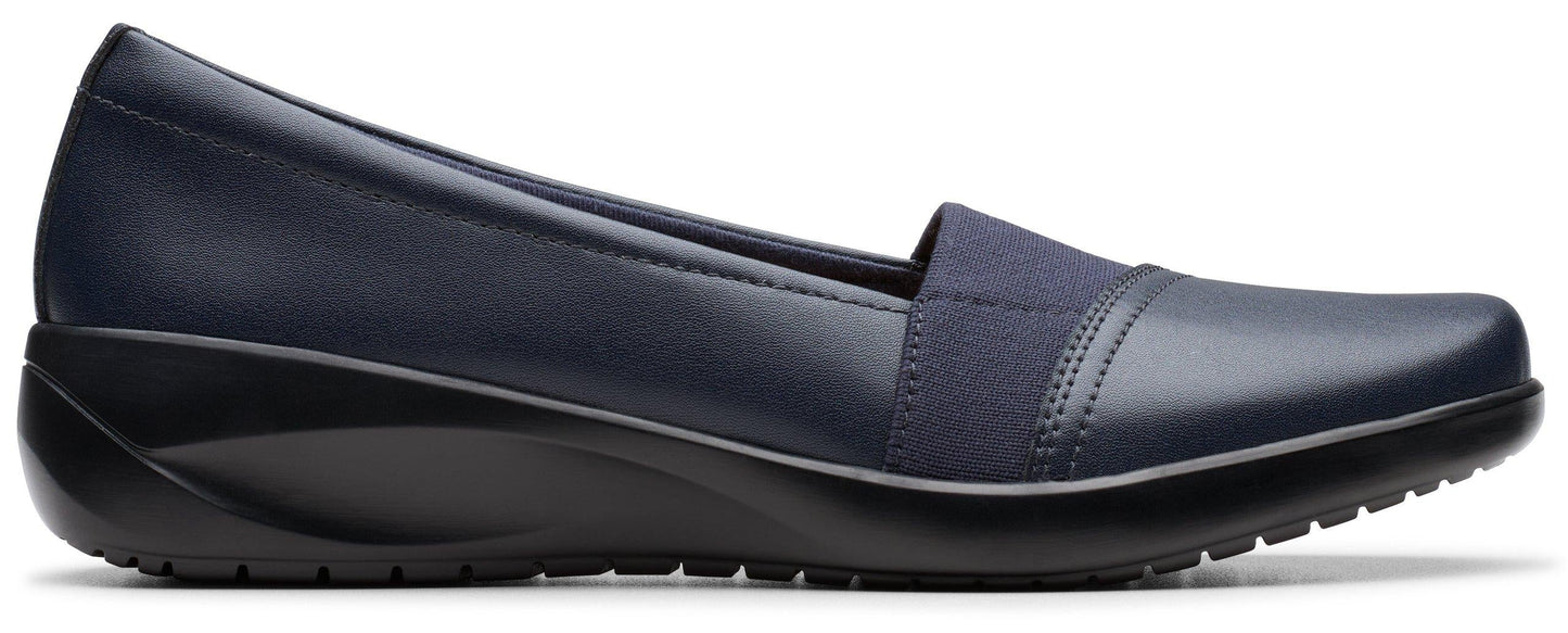 A navy-blue slip-on shoe with a flat, black sole.